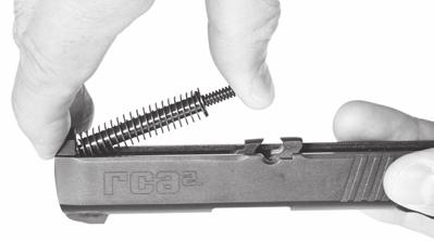 TO REASSEMBLE 1. Be certain the chamber and magazine are empty. 2. With the slide held upside down, replace the barrel and push it rearward into its locked position. (See Figure 14.) 2 1 Figure 14 3.
