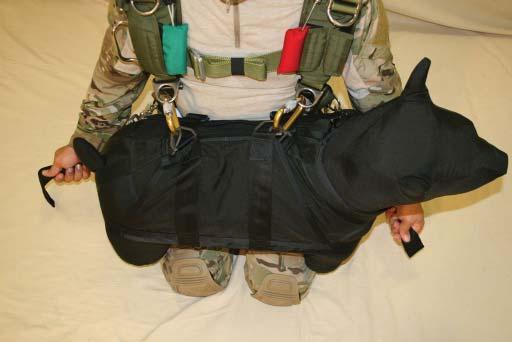 23. Tighten down both the left and right lower attachment straps so the K9 is snug to the jumper s body.