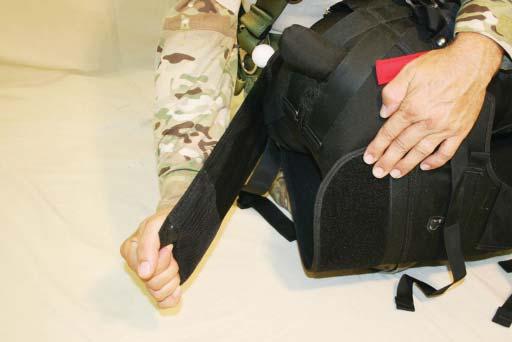 Pull the right side Velcro tab around the hind quarters of the K9 and connect