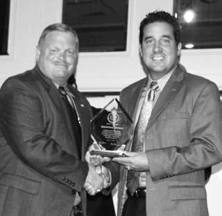 Rick Theobald (right), Buffalo District, accepts the award from Region 1 VP Brian