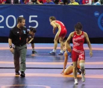 Walking the Wrestlers back to the center Control of the match Talk to