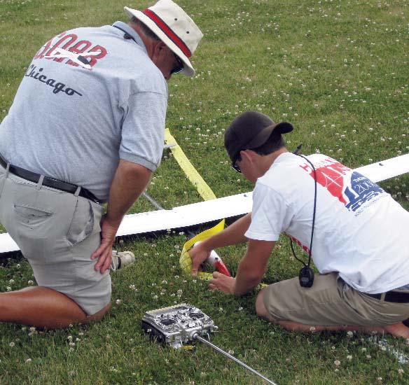 Right: Rich Burnoski s landing distance is carefully measured by Jeff Walter before the sailplane is moved from its position.