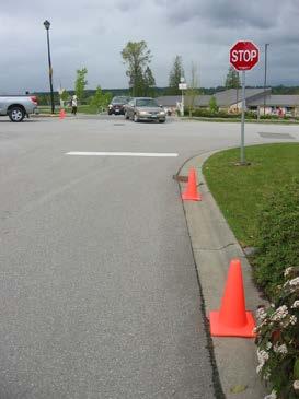 2. Monitor safety and operation in the school parking lot & place orange cones in critical areas The 22 stall parking lot and on-site pick-up / drop-off facilities are relatively small and are