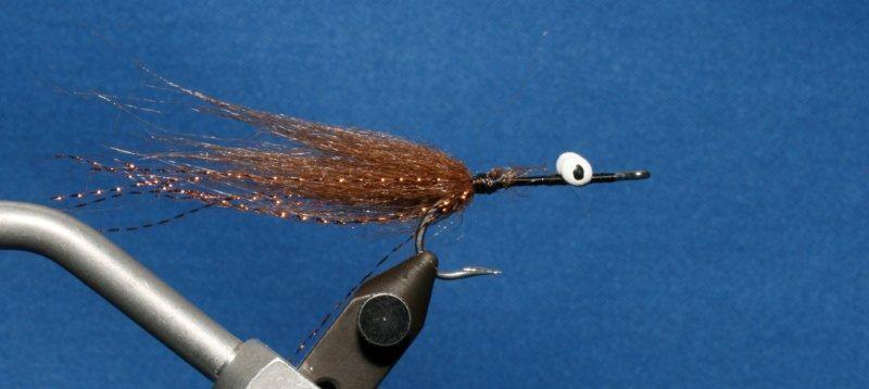 Start thread behind hook eye and wrap to middle of hook shank, then back to about 2 hook eye widths from hook eye.