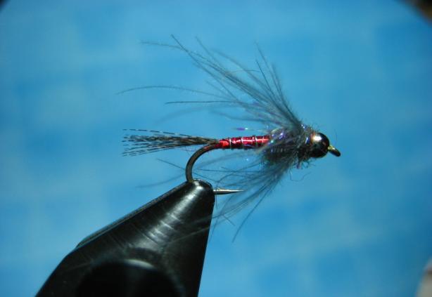 Page 3 ` DELEKTABLE LIL RED SPANKER This pattern was originated in Montana and designed by fishing guide, Dan Delekta.