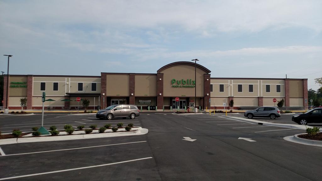 PROPERTY OVERVIEW is a newly opened retail shopping center, located at the northwest corner of NC Hwy 210 and NC Hwy 50. The subject is less than 2.