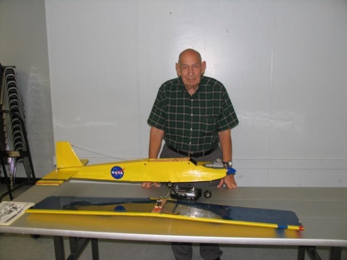 Bruce with one of his new gadgets. A hanger from Harbor Freight perfect for hanging all his planes.