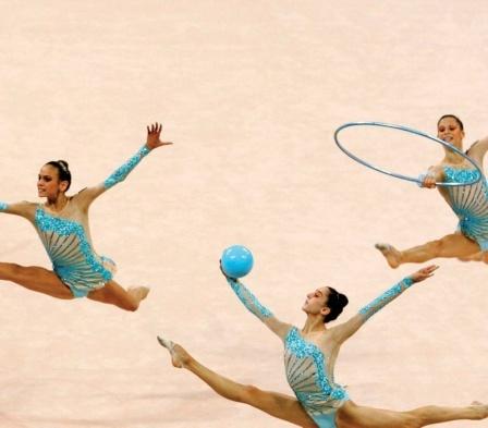Rhythmic gymnastics combines dancing with gymnastic skills. The routines are performed to music. Athletes add to the beauty of their dancing by using hoops, ropes, balls, ribbons, and clubs.