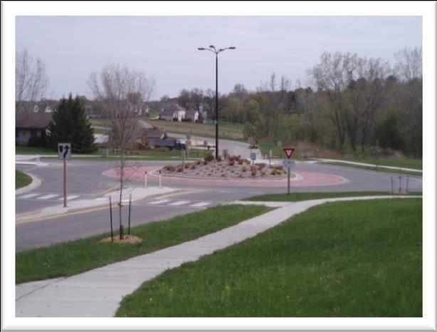 Integrate safety measures (buffers, medians, traffic calming, roundabouts, cross access easements, etc) into all road