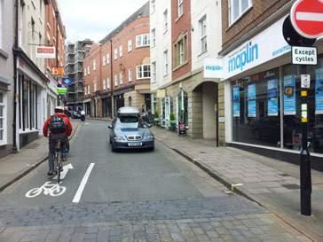 as a safe design option, even on narrower city or town centre streets that have a high number of pedestrian movements or frequent kerbside parking It can be relatively cheap to implement and the