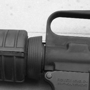 9. If it becomes necessary to clean the buffer area in buttstock, depress the buffer while maintaining pressure to prevent buffer assembly from being ejected.