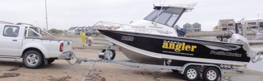Stop the motor and lift the propeller leg. Move boat & trailer 3M (10ft) approx. out of water.