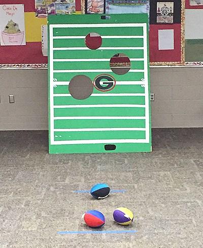 Nerf Football Toss Football toss: Let kids try to score a touchdown by throwing a football through