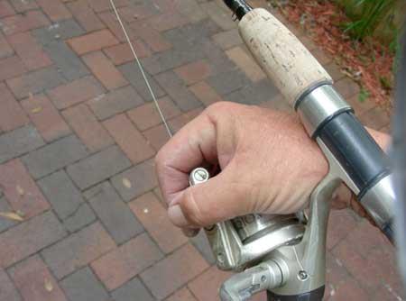 Next, point the rod as close to the stuck lure as you can, and make sure you cover the face of the reel.
