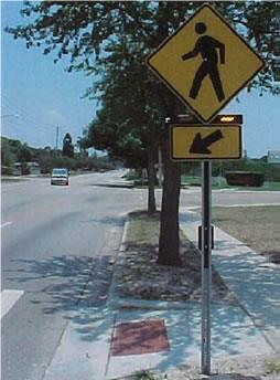 Figure 10: Pedestrian Crossing Rectangular Rapid Flashing Beacon (RRFB) RRFB s can enhance pedestrian safety by reducing crashes between vehicles and pedestrians at unsignalized intersections and