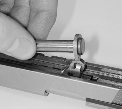 FIGURE 25 (FIGURE 23). Fully cock the hammer to make it easier to push the slide back.