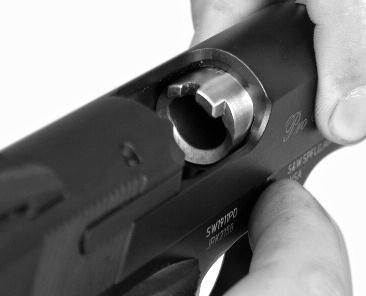 FIGURE 31 Point the pistol in a safe direction and remove the magazine, clear the chamber and verify that the firearm is unloaded (FIGURE 31).
