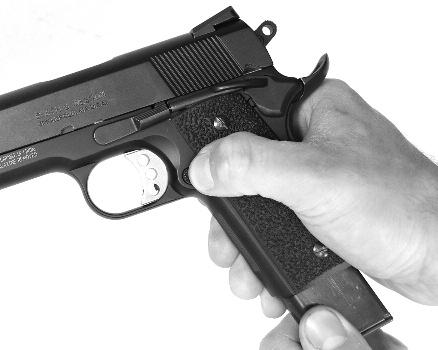 FIGURE 32 Firmly grasp the pistol and apply rearward force on the slide and move it back until the takedown notch is aligned with the slide stop (FIGURE