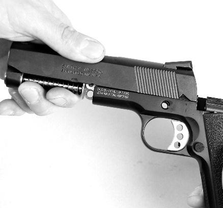 FIGURE 35 Remove the guide rod and recoil spring from under the barrel (FIGURE 37). FIGURE 36 WARNING: DO NOT DRY FIRE YOUR SW1911 AND SW1911 E-SERIES SERIES PISTOL WHILE THE SLIDE IS REMOVED.