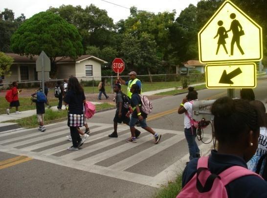 employees leading a walking school bus is a great was to show walkability in