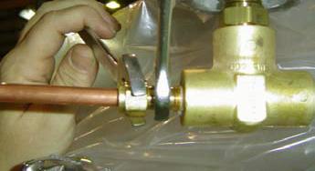 Place the nut and ferrules over the tube as shown in the example on the right, then insert the tube into the fitting body as far as it will go.