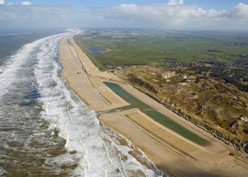 1) along the coastal section between Camperduin and Petten has been replaced by a natural beach-dune system of sand in the period 2012-2014 resulting in a coastline
