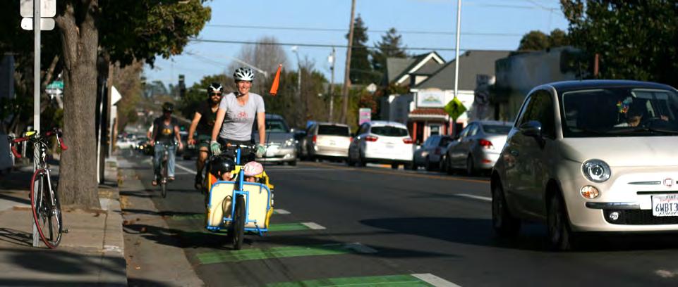 Colored Bicycle Lane A colored bicycle lane on Laurel Street in Santa Cruz, CA alterts users to potential merging in advance of an intersection. Photo by Richard Masoner via Flickr (CC BY-SA 2.0).