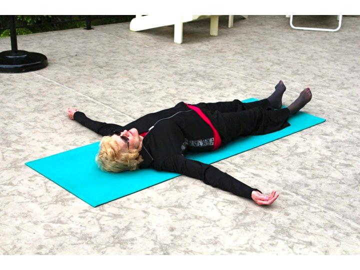 Slowly start to ease yourself on to your back. Lay down into final pose called svasana.