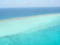From here, you will fly down the second largest Barrier Reef in the world, the largest in the Western Hemisphere.