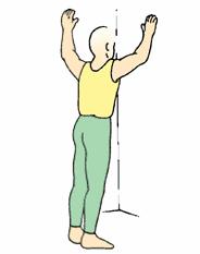 Stand in a doorway or the corner of the room with both arms stretched on the doorway or on the walls slightly above your head as pictured.