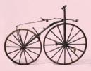 It was made of metal and had a high front wheel and solid rubber tyres.