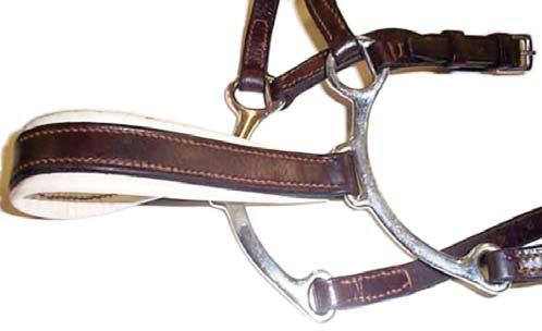 Photos of a Crescent noseband both off and on a horse -- allowed with a snaffle bridle in National level classes only. NOTE: The Crescent noseband may not be used in any FEI classes.
