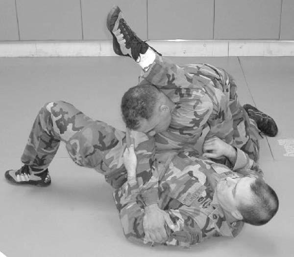 Figure 4-64. Ankle grab/knee push, step 3. d. Triangle Choke.