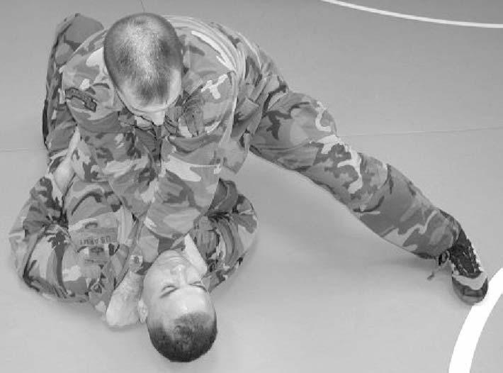 c. Attacks from the Knee Mount. (1) Chokes with Hand on the Far Side of the Enemy s Neck. (a) Step 1 (Figure 4-74).