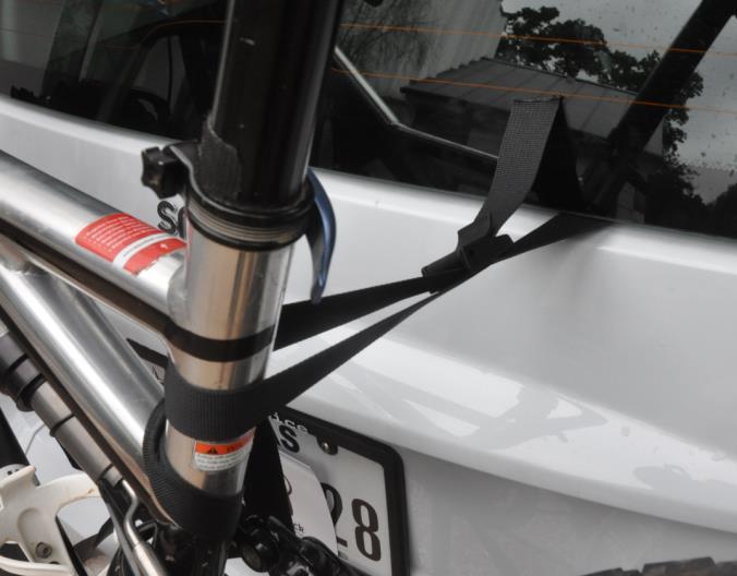 Ensure that the bike is centered on the bike mounts when tightened.