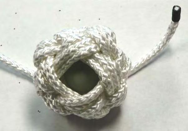 The knot should be moulded around the ball in a circular motion using the palms of the hands until the original opening is no longer evident.