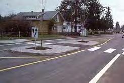 8.6.3 Center Island Narrowing and Pedestrian Islands: A center island narrowing is a raised island in the center of the street that narrows the overall width of the travel lanes.