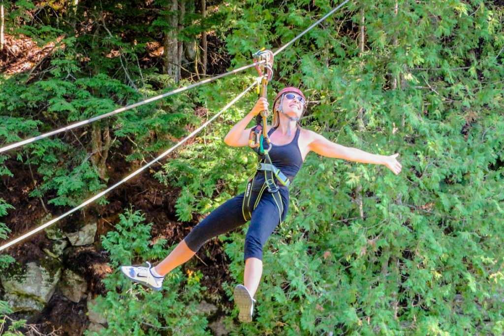 which make it physically impossible to become detached from the zipline, and encouraging me to hang above the platform in my harness to get used to the feeling while ensuring I