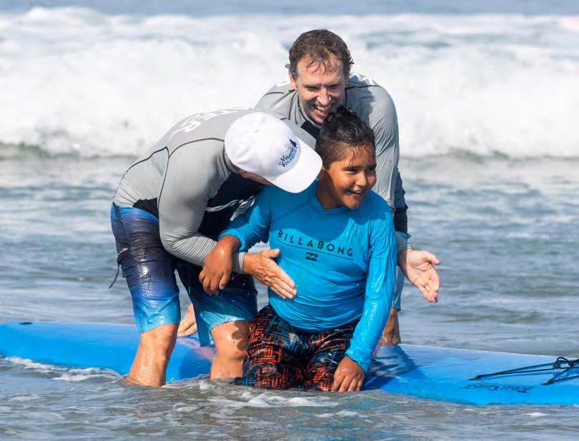 Surf therapy helps CHOC kids get relief from the ocean in Newport Beach Orange County Register Page 6 of 8 3 of 7 Manuel Miranda is congratulated by two instructors as he surfed at the Newport Beach