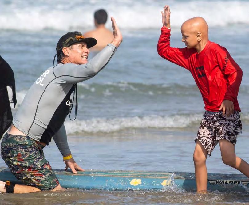 Surf therapy helps CHOC kids get relief from the ocean in Newport Beach Orange County Register Page 7 of 8 5 of 7 Alex Hays gets a high-five from instructor Bobby Friedman catch while surfing at the