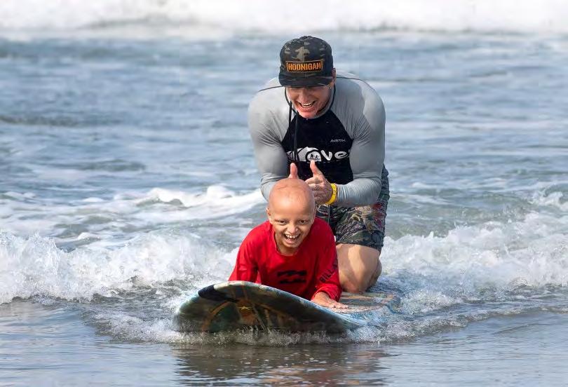 Surf therapy helps CHOC kids get relief from the ocean in Newport Beach Orange County Register Page 8 of 8 7 of 7 Alex Hays gets encouragement from instructor Bobby Friedman catch while surfing at