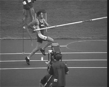 However, importantly, the heel strikes the ground for an active landing. This occurs under the center of mass, allowing the vaulter to continue pushing forward, reacting against the ground.