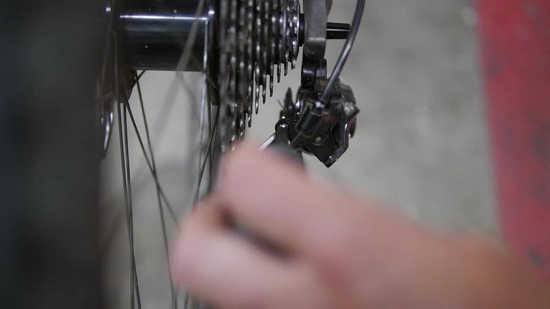Step 3 Adjust the high limit screw, this screw limits the derailleur movement to the outside, between the smallest cog and the dropout Sight down the back of the bike,