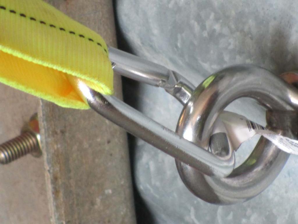 Tag 17, an 1800 pound anchor rating: Yellow webbing attached to a ½ stainless welded eye bolt that is installed through the peak of