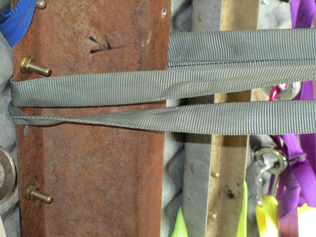 Tag 3, an 1800 pound rated anchor: An olive green 1 webbing that is wrapped
