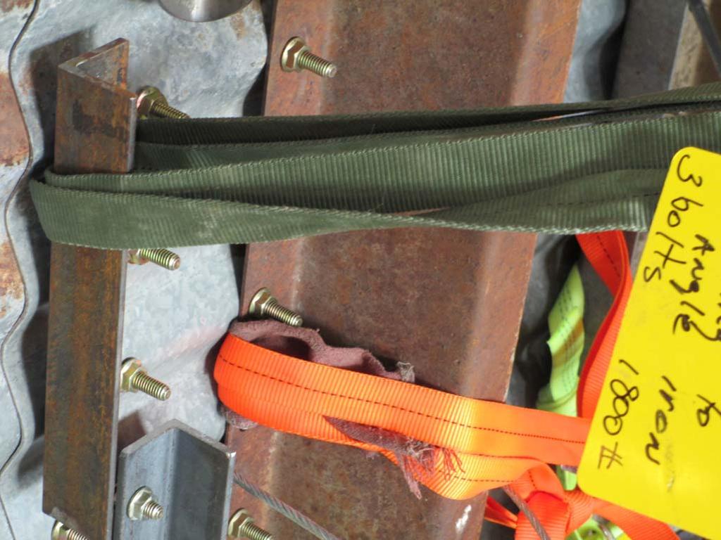 Tag 18, an 1800 pound rated anchor: An olive green 1 webbing sling that was pre tied by a water knot and wrapped