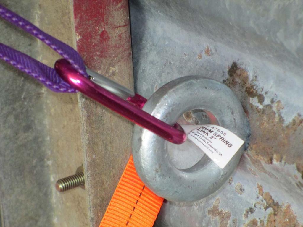 Tag 10, a 3600 pound rated anchor: Purple webbing attached to a forged ¾ eye bolt that is installed through the peak of the