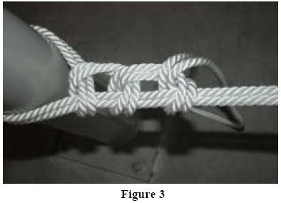 Tie a clove hitch and binder on the taut part of the rope. (Figures 2 and 3) 3.