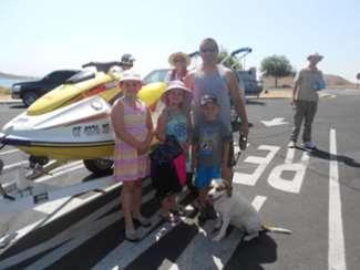 watercraft and below, the family poses while Ron Werner