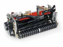 A powered rear roller brush system keeps